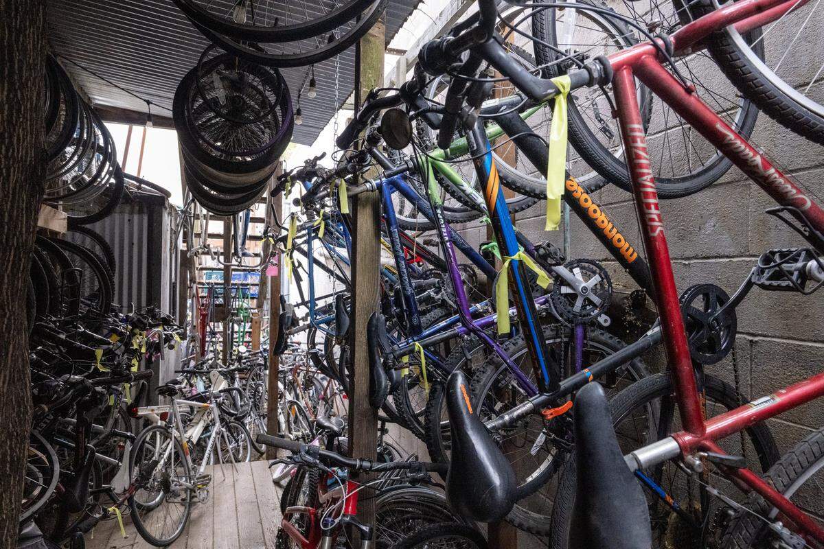 Donated bikes wait in a backroom to be fixed at the Sacramento Bicycle Kitchen on Tuesday.