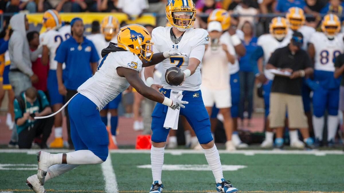 Grant Pacers quarterback Luke Alexander (7) hands off to Wayshawn Parker (1) on Aug. 25 at Oak Ridge High School.