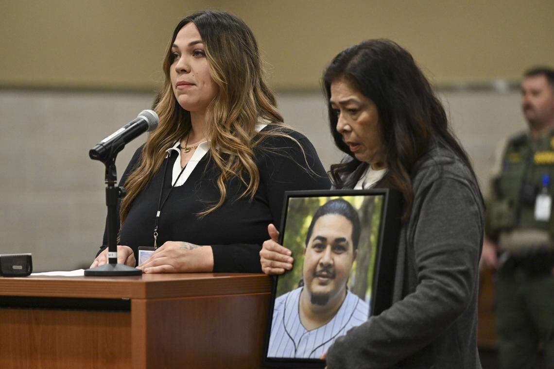 Lupe Melendez-Mendoza holds a photo of her son, Esparto explosion victim Joel Melendez, as she stands alongside Melendez’ wife Maria Melendez in Yolo Superior Court in Woodland on Thursday, April 16, 2026 for the arraignment of those indicted in the explosion.