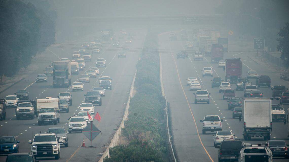Vehicles on Interstate 80 in Vacaville drive through smoke from California’s wildfires on Monday, Aug. 24, 2020. Air quality readings for particulate matter (PM 2.5) in the city reached “very unhealthy” levels – 264 on the Air Quality Index – on Monday, according to the Sacramento Metropolitan Air Quality Management District.