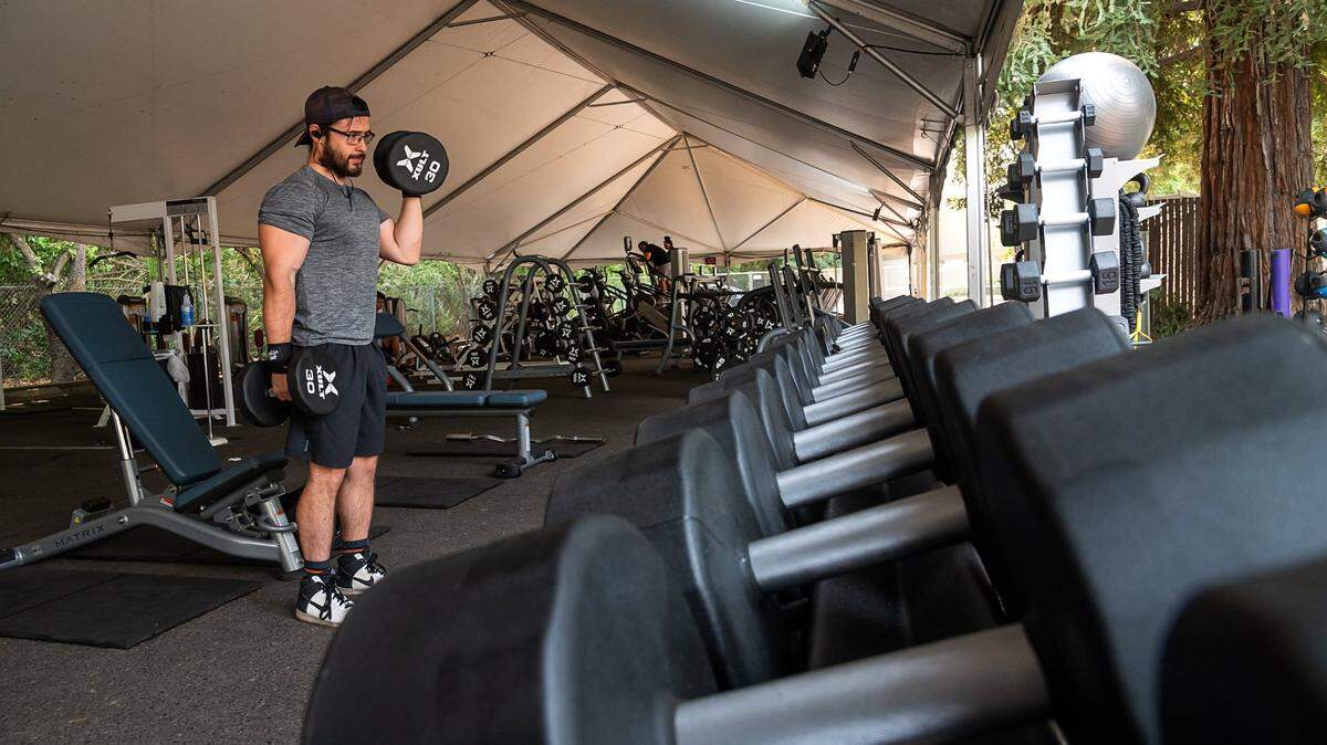 FILE PHOTO — Carlos Gonzalez, 28, works out at the outdoor workout area set up at the California Family Fitness in the Greenhaven area on Friday, Sep 4, 2020. Gonzalez has been working out at home to keep in shape and recently returned to the gym.
