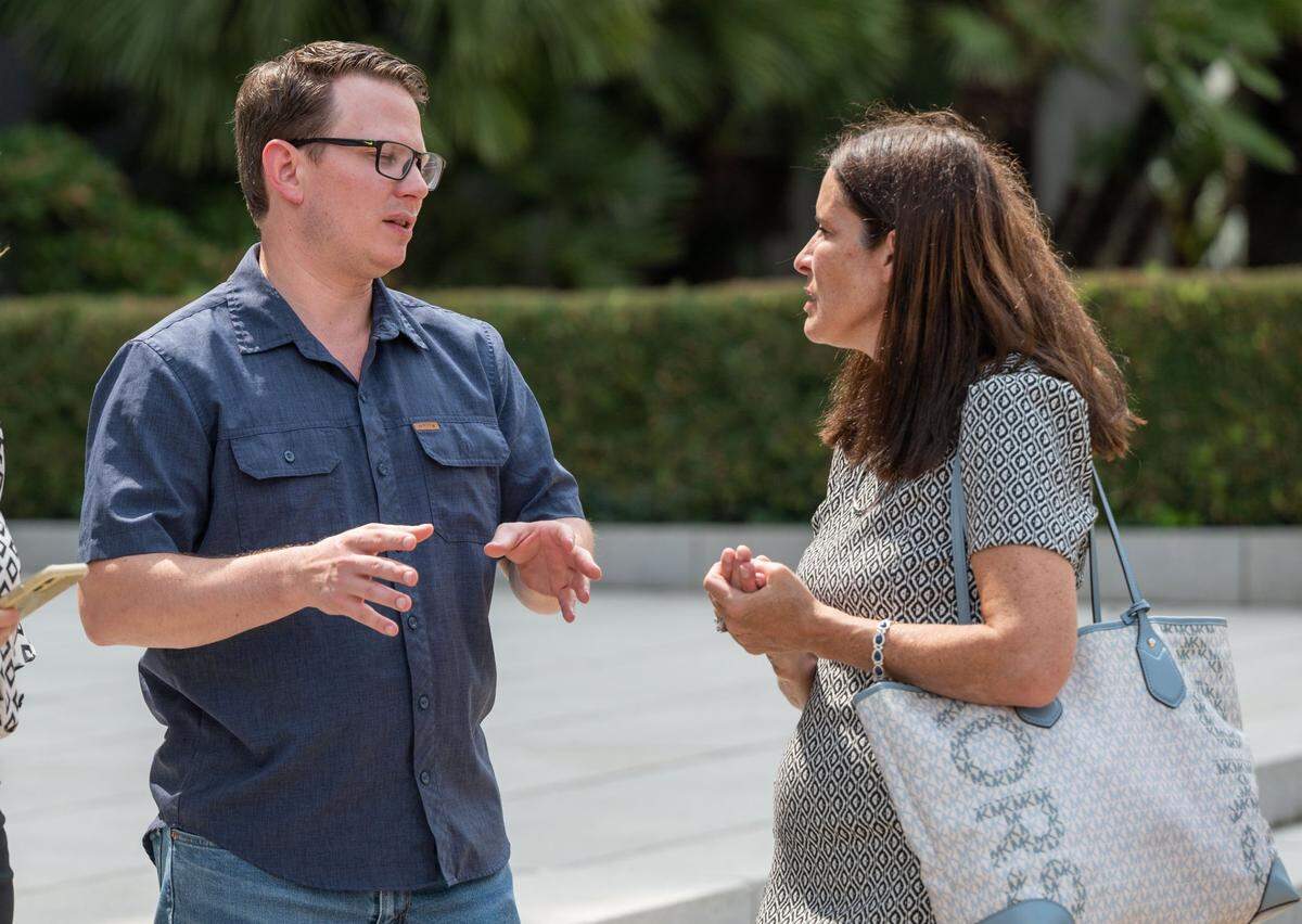 Roseville City Unified School District board member Jonathan Zachreson talks with Erin Friday, one of the speakers at a parental rights rally at the state Capitol in 2023.