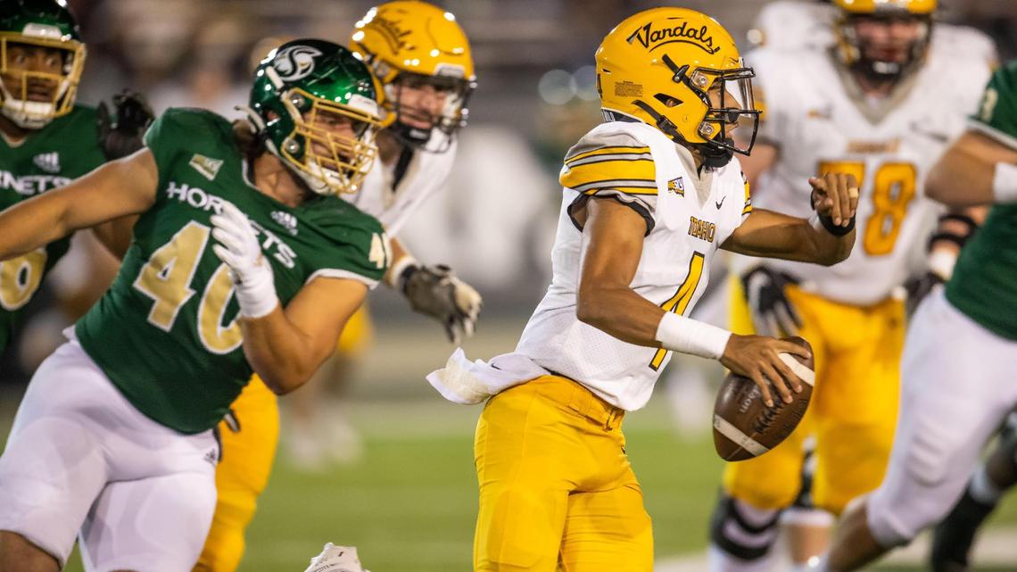 Idaho quarterback Gevani McCoy, right, scrambles during an Oct. 29, 2022, game in Sacramento, Calif. McCoy completed 19 of 26 passes for 343 yards but threw two costly interceptions as the Vandals lost to Southeast Louisiana in the FCS playoffs on Saturday in Hammond, La.