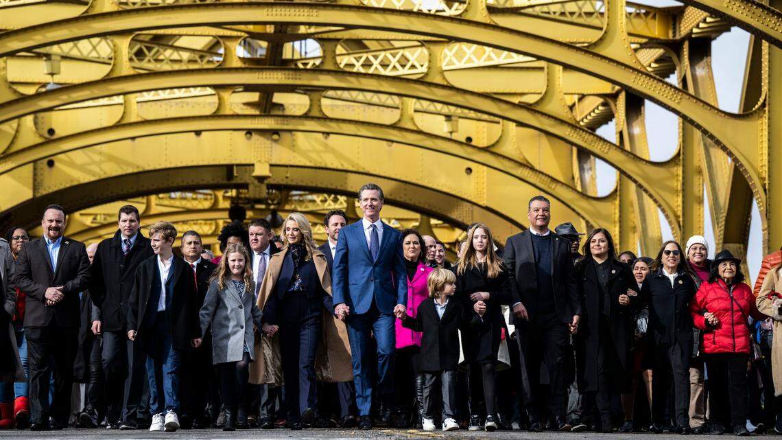 California Gov. Gavin Newsom participates in a march from the Tower Bridge with with his family and various dignitaries and community members on Friday, January 6, 2023.