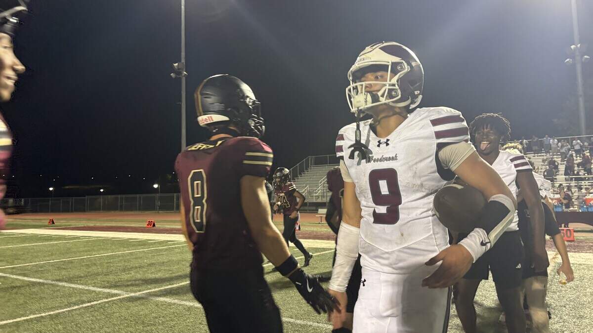 Woodcreek quarterback Josiah Melendez shakes hands after a 37-20 win Friday against Whitney at Whitney High School in Rocklin.