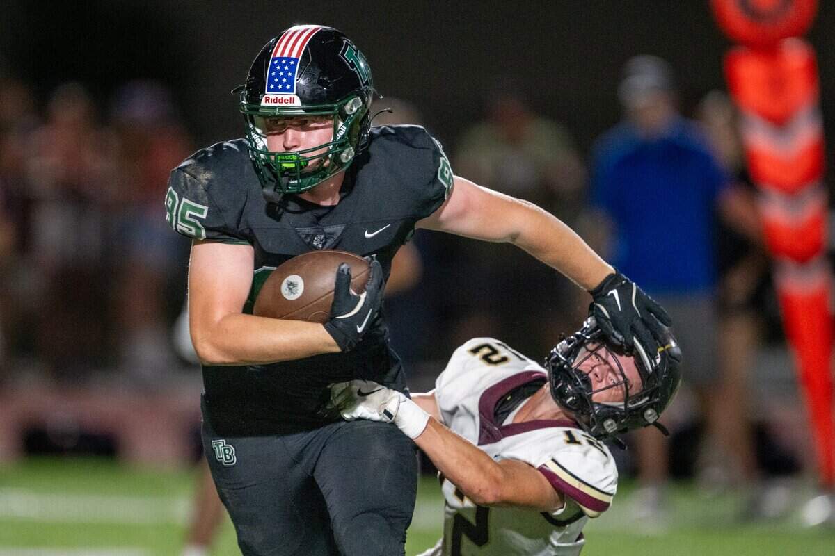 Twelve Bridges tight end Will Leeth (85) runs past the Whitey Wildcats’ Parker Kanan (12) after a catch in September. The Raging Rhinos are the top seed in Division IV. 