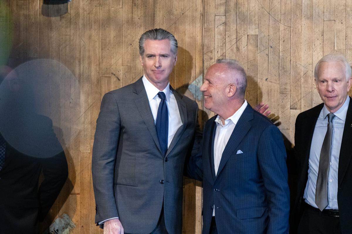 Gov. Gavin Newsom and former Sacramento Mayor Darrell Steinberg visit at the opening of the San Quentin Learning Center on Friday.