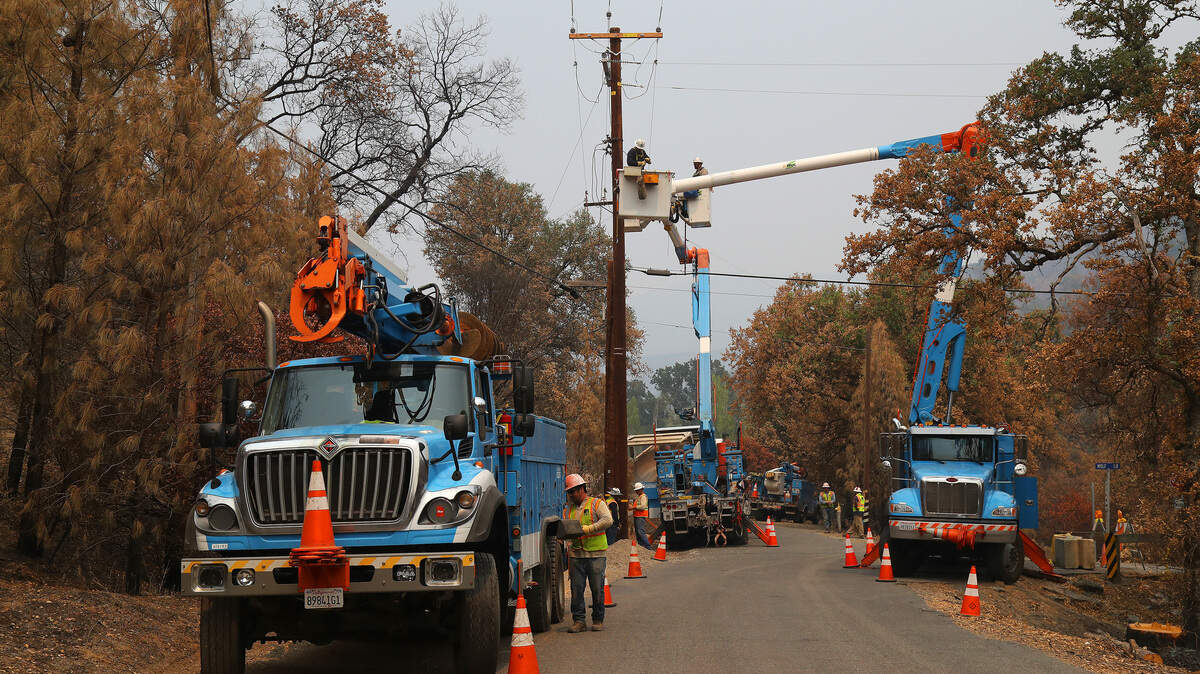 Pacific Gas & Electric crews repair power lines after the Ranch fire burned through the area near Clearlake on  Aug. 8.