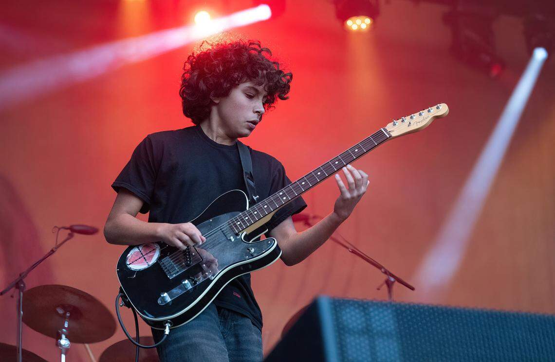 Roman Morello, left, son of Rage Against the Machine’s Tom Morello, plays a guitar solo during at the Aftershock festival in Sacramento’s Discovery Park on in 2024.