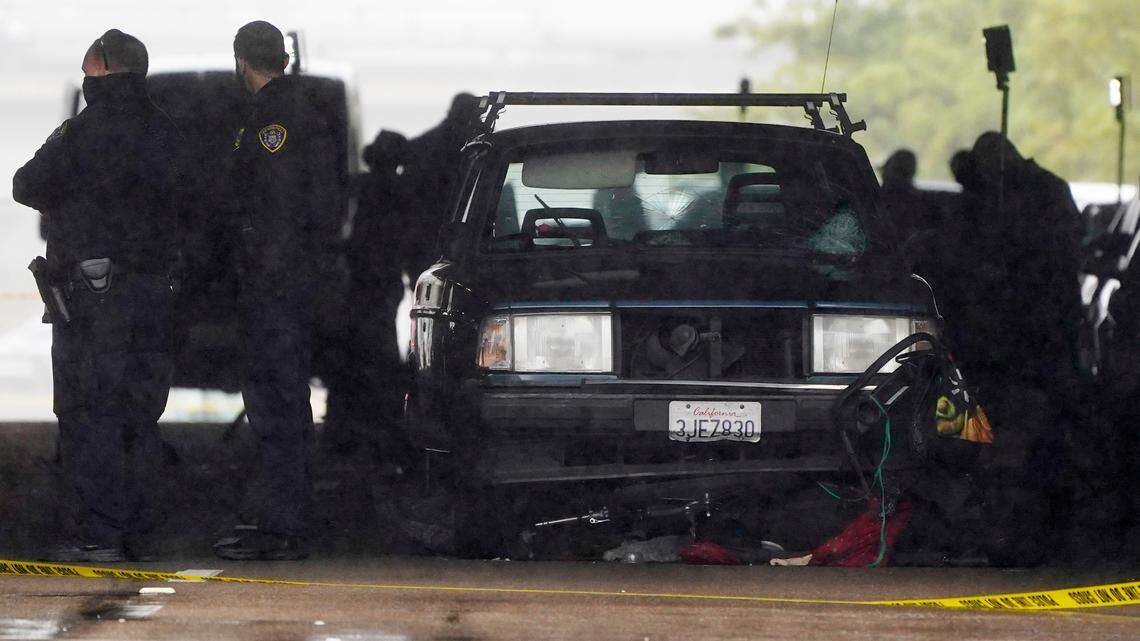 A car involved in a deadly accident sits at the scene Monday, March 15, 2021, in San Diego. A driver plowed through a crowd on a sidewalk in downtown San Diego on Monday morning, killing three people and injuring six others, including two who are hospitalized in critical condition, police said. (AP Photo/Gregory Bull)