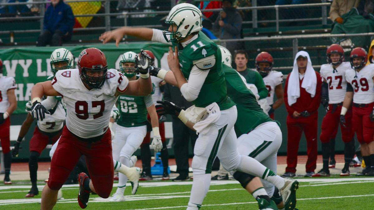Dartmouth's Jack Heneghan attempts a pass against Harvard. The 6-4, 230-pound quarterback is expected to sign a free-agent rookie deal with the 49ers