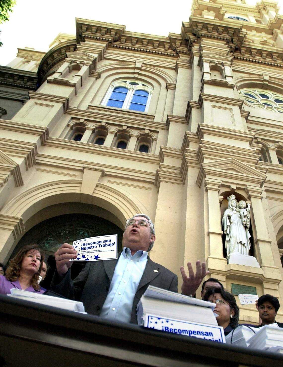 Bill Camp, executive secretary of the Sacramento Central Labor Council, joins leaders from the United Farm Workers, local political leaders and other citizens in 2002 at downtown Sacramento’s Cathedral of the Blessed Sacrament to kick off a nationwide campaign to deliver a million postcards to President George W. Bush urging him and Congress to “support immigration policies that reward work by giving hard-working, tax-paying immigrants already in the U.S. the opportunity to earn legal status.” Camp, the labor council’s longtime leader, died Sept. 23 at the age of 80.