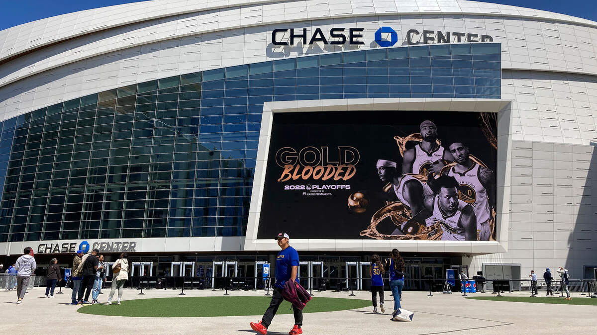 Fans walk outside of the Chase Center before Game 3 of an NBA basketball second-round playoff series between the Golden State Warriors and the Memphis Grizzlies in San Francisco, Saturday, May 7, 2022. (AP Photo/Jeff Chiu)