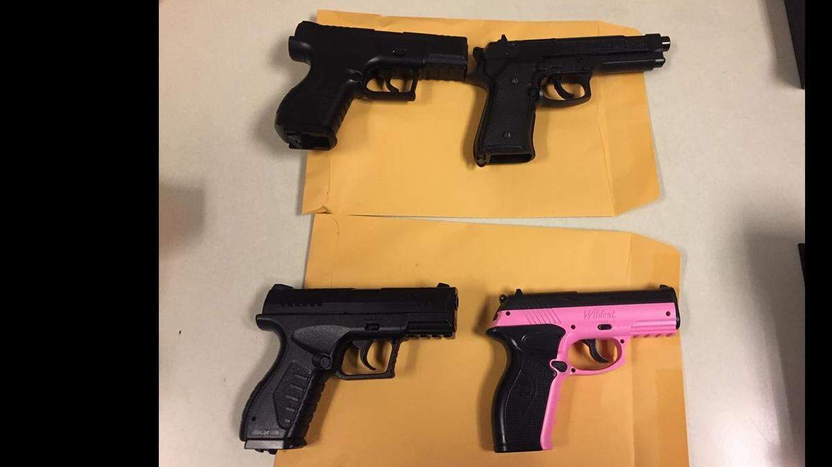 One woman and seven minors were arrested after three people were robbed on Friday night with air guns, according to the Davis Police Department. The air guns, designed to look like real guns, are pictured here.