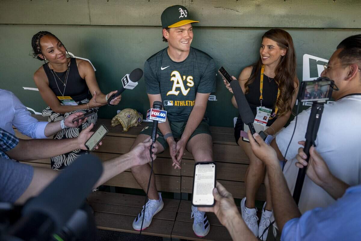 Jamie Arnold, the Athletics’ 2025 first-round draft pick, speaks with reporters in the dugout before a baseball game at Sutter Health Park in West Sacramento on July 28, 2025. Arnold, the organization’s No. 2 overall prospect, was on Wednesday named to the All-Star Futures Game.