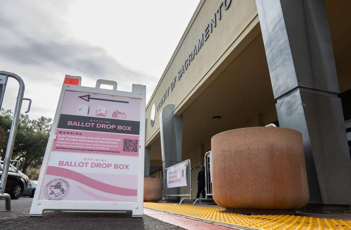 A sign directs voters to the ballot box at the Sacramento County Voter Registration and Elections office on Tuesday.