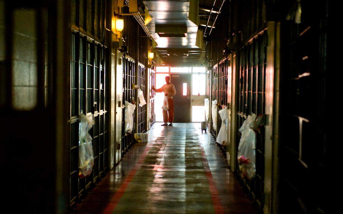 An inmate hands out supplies inside a dorm at the Rio Cosumnes Correctional Center in Sacramento County in 2009.