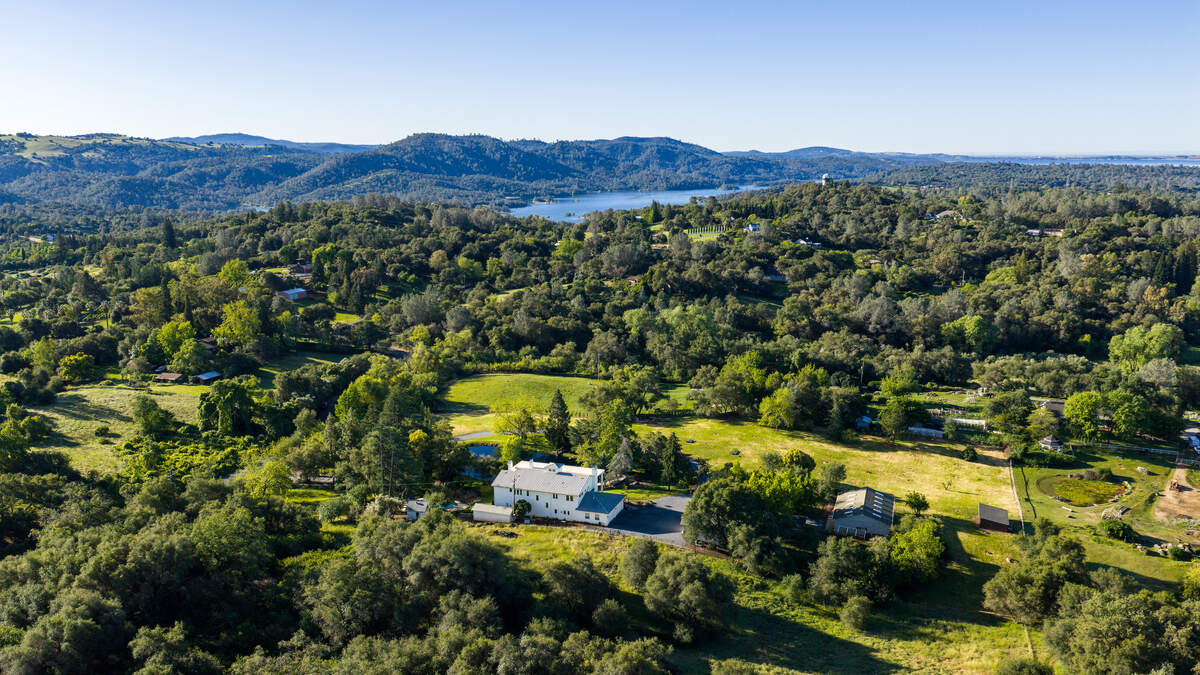 From above, the 6.6-acre property sits in the Sierra foothills within easy reach of Folsom Lake and the outdoor recreation corridor east of Sacramento.