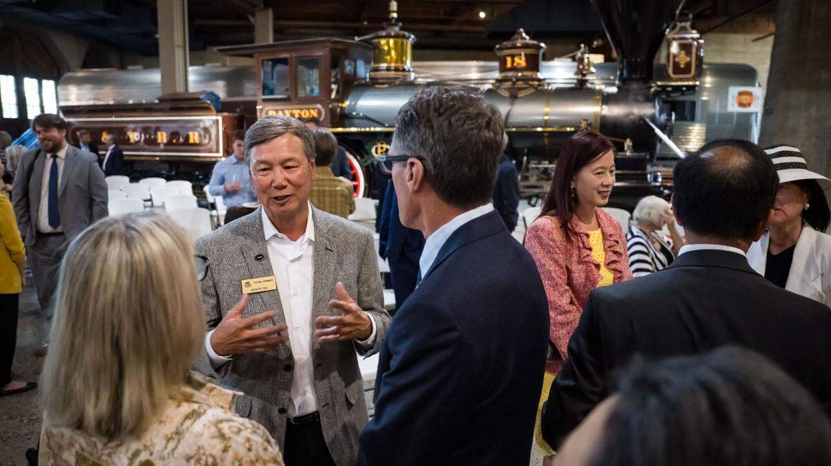 Dr. Wesley Yee, left, whose father Dr. Herbert Yee died in 2021, mingles with attendees after his father was honored by the California State Railroad Museum and Foundation on Wednesday, June 21, 2023, in Sacramento. The museum and foundation dedicated the Chinese Railroad Workers’ Experience exhibit to the late civic leader and philanthropist. Fremont Mayor Lily Mei, right, was one of many dignitaries at the event.