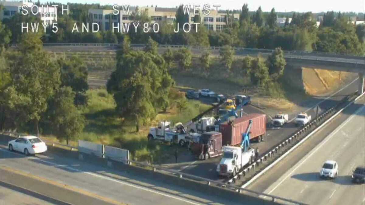 An overturned semi-truck is blocking traffic near the junction of Interstate 5 and Interstate 80 in north Sacramento on Wednesday evening.