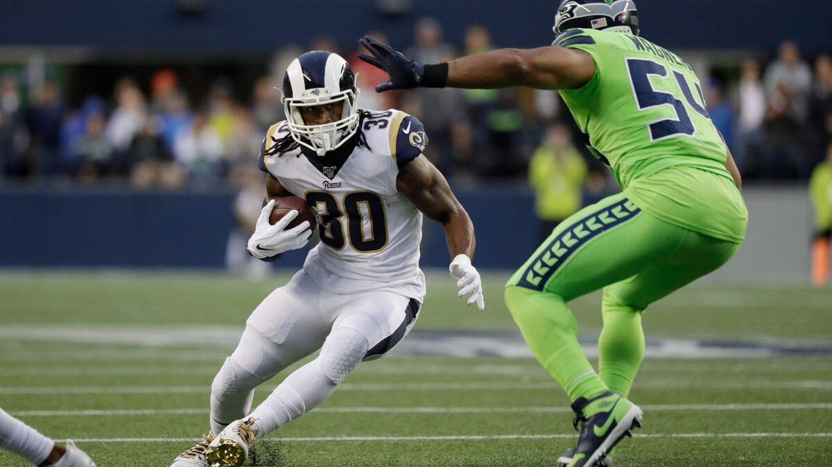 Los Angeles Rams running back Todd Gurley, left, squares off against Seattle Seahawks middle linebacker Bobby Wagner during the first half of an NFL football game Thursday, Oct. 3, 2019, in Seattle. (AP Photo/Elaine Thompson)