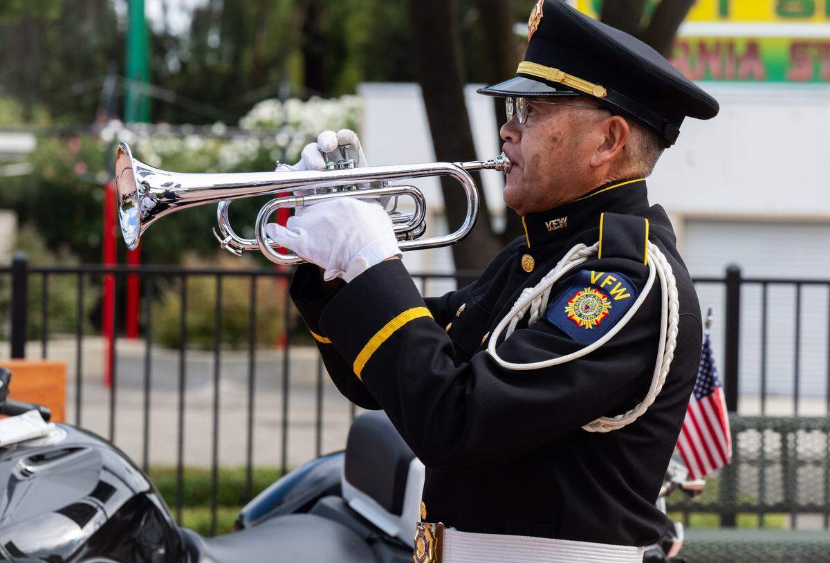 Veterans of Foreign Wars state bugler Baldwin Wong plays taps during the 9/11 Remembrance Ceremony at September 11 Memorial Plaza at Cal Expo in Sacramento on Thursday.