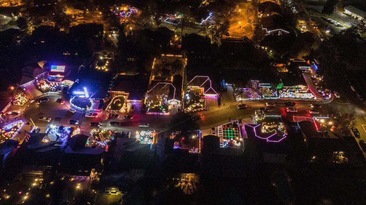 The 18 homes on the Dovewood Court cul-de-sac in Orangevale glow with Christmas spirit on Monday Dec. 9, 2024.