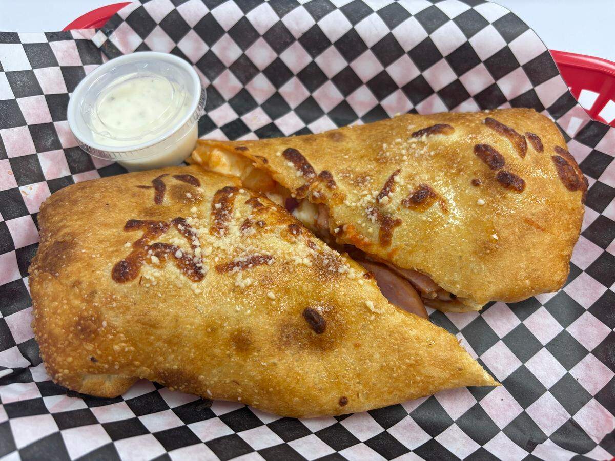 The $13.99 “Heavenly” at Notty’s Italian Burrito in Rocklin includes Canadian bacon, pineapple, red onion, bacon bits and a mango habanero sauce.