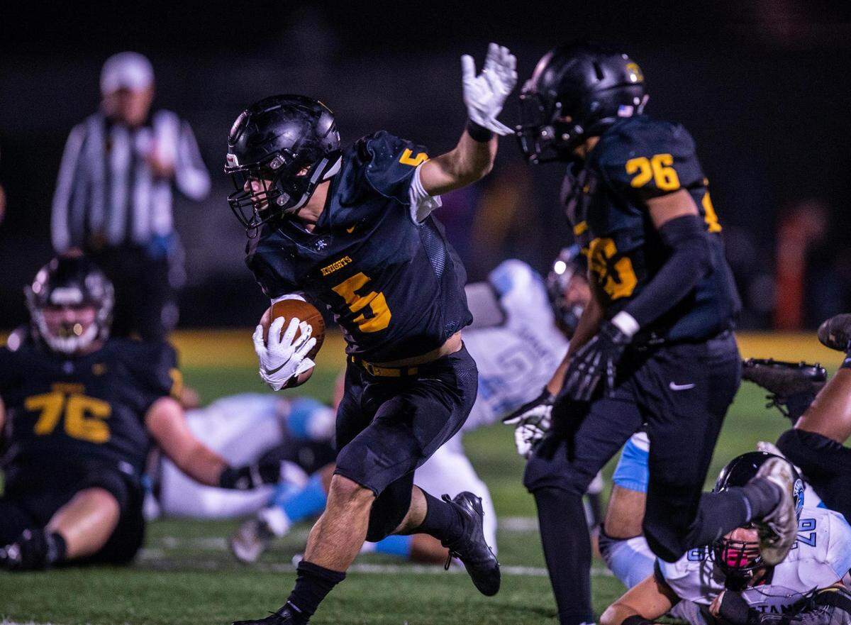 Rio Linda’s Cameron Skattebo (5) runs the ball 10 yards during the first quarter in the CIF State Division 5-AA championship football game between Rio Linda High School and San Gorgonio at Rio Linda High School in 2018.