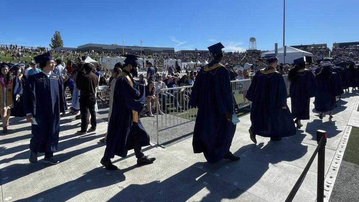 UC Davis graduates are seen during ceremonies at UC Davis Health Stadium on Friday, June 10, 2022. UC Davisâ graduation ceremony was abruptly cut short Friday due to extreme heat as the university told students and families to clear the stadium and return on Sunday.