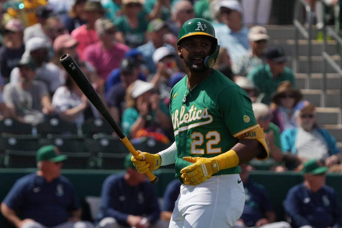 Mar 17, 2025; Mesa, Arizona, USA; Oakland Athletics outfielder Miguel Andujar (22) reacts after striking out against the Seattle Mariners in the third inning at Hohokam Stadium. Mandatory Credit: Rick Scuteri-Imagn Images