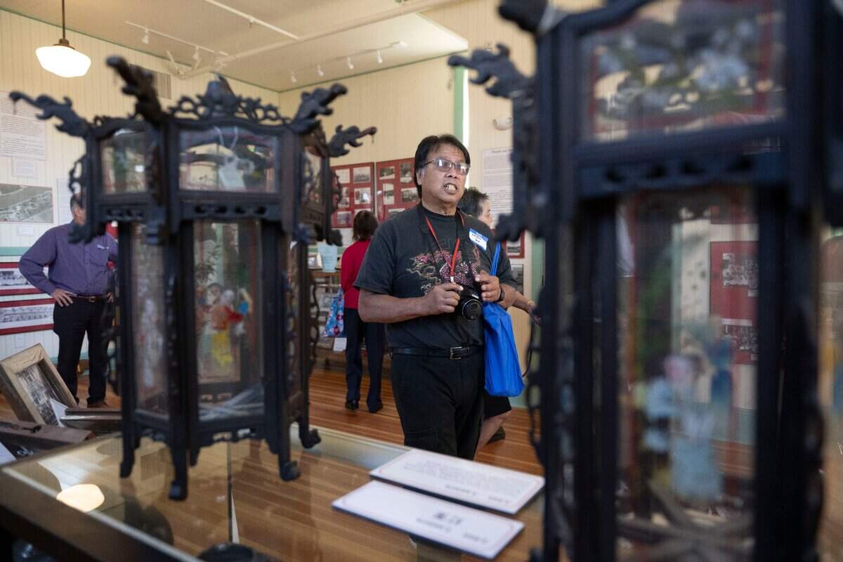Lester Yee of South San Francisco, a descendant of the Toy family, whose patriarch was known as the mayor of Isleton’s Chinese quarter, looks at items on display Thursday at the renovated Bing Kong Tong building.