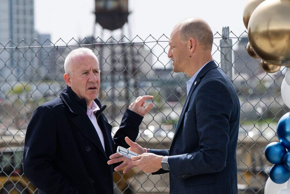 Former Sacramento Mayor Darrell Steinberg talks with Mayor Kevin McCarty after the groundbreaking for the new Kaiser Permanente Railyards Medical Center on Wednesday.