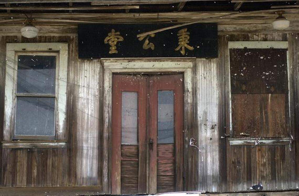 The second-floor entrance to the Bing Kong Tong building in Isleton sits in disrepair in this 2002 photo. The Isleton Brannan-Andrus Historical Society raised funds to restore the building, which once was a Chinese language school and cultural center where weddings and funerals took place.