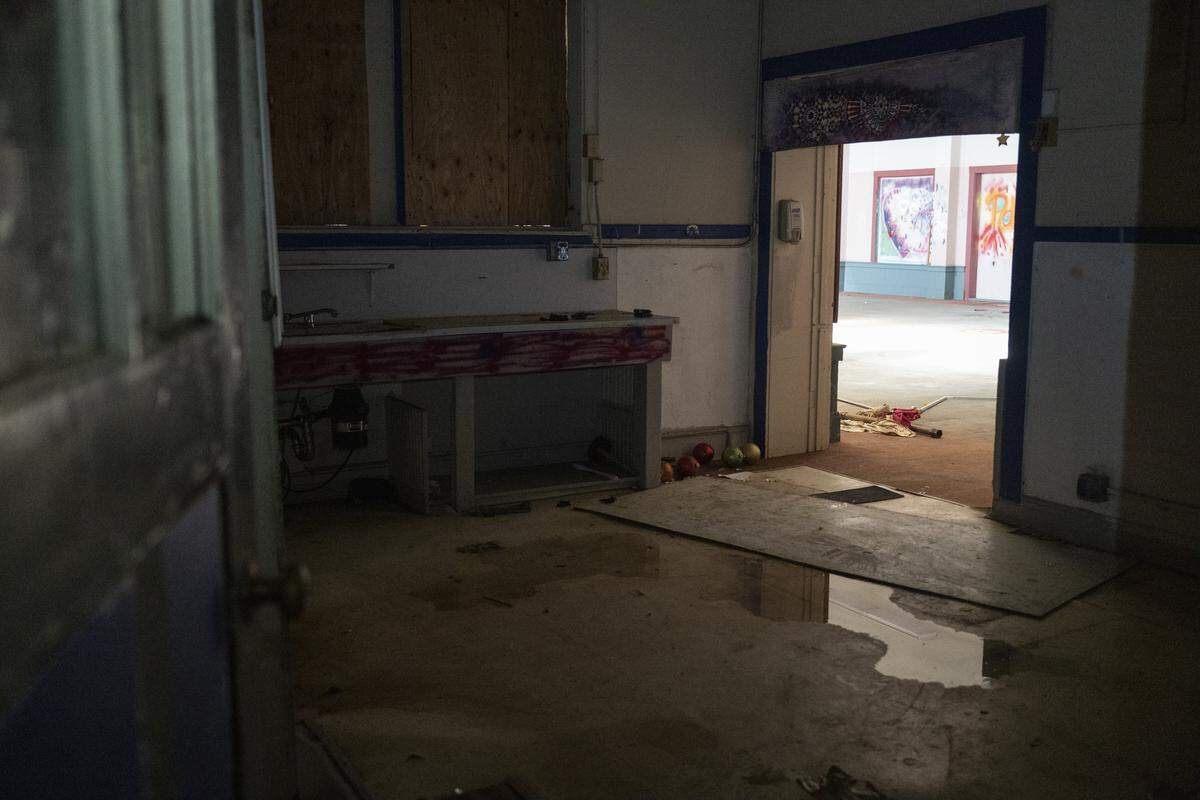 Water pools inside the Old North Sacramento School earlier this month