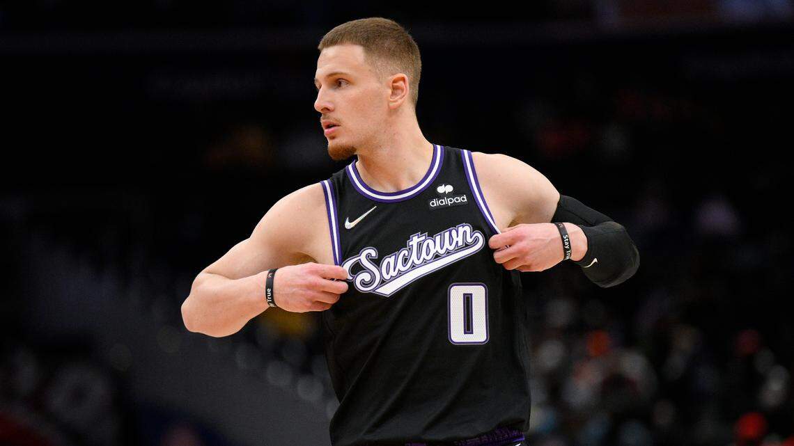 Sacramento Kings guard Donte DiVincenzo (0) looks on during the first half of an NBA basketball game against the Washington Wizards, Saturday, Feb. 12, 2022, in Washington. (AP Photo/Nick Wass)