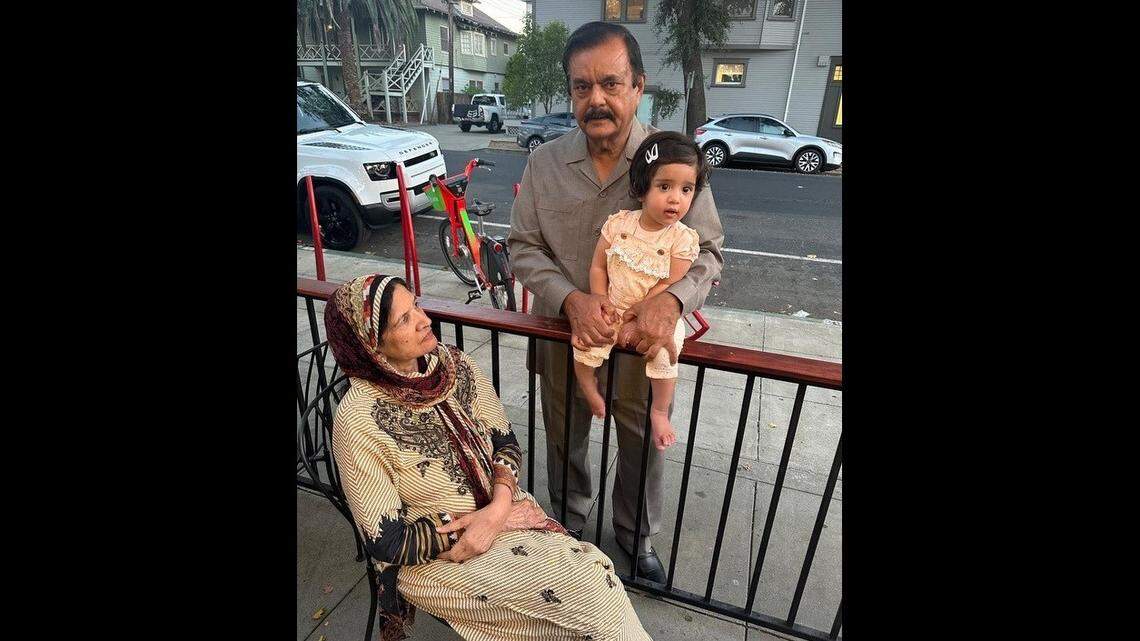 Muhammad Saddique holds his second grandchild, Irha. His wife, Talat Noeen, looks on. Saddique was the second person to die at a Sacramento intersection this year.