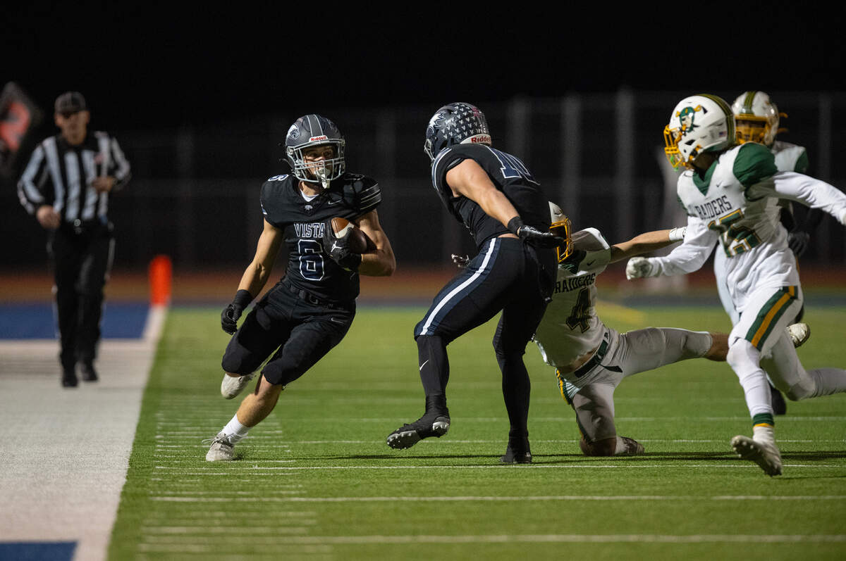 Vista del Lago Eagles running back Jack Cromwell (6) picks up a first down against Rio Americano in the second quarter on Friday in Folsom. Cromwell had 122 yards.