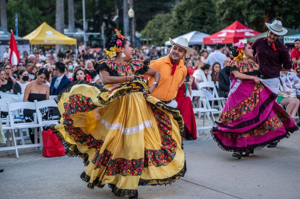 Angie Alamilla Castillo and Víctor Paez perform a dance from the state of Sinaloa during celebrations of the Mexican Day of Independence at the state Capitol on Thursday evening.