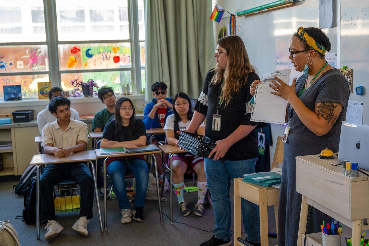Sacramento County elections office assistant Kinu Van Vorhis holds a ballet as she explains the correct way to fill it out before a mock election West Campus High School in 2024. The school was recognized among the 2026 California Distinguished Schools.