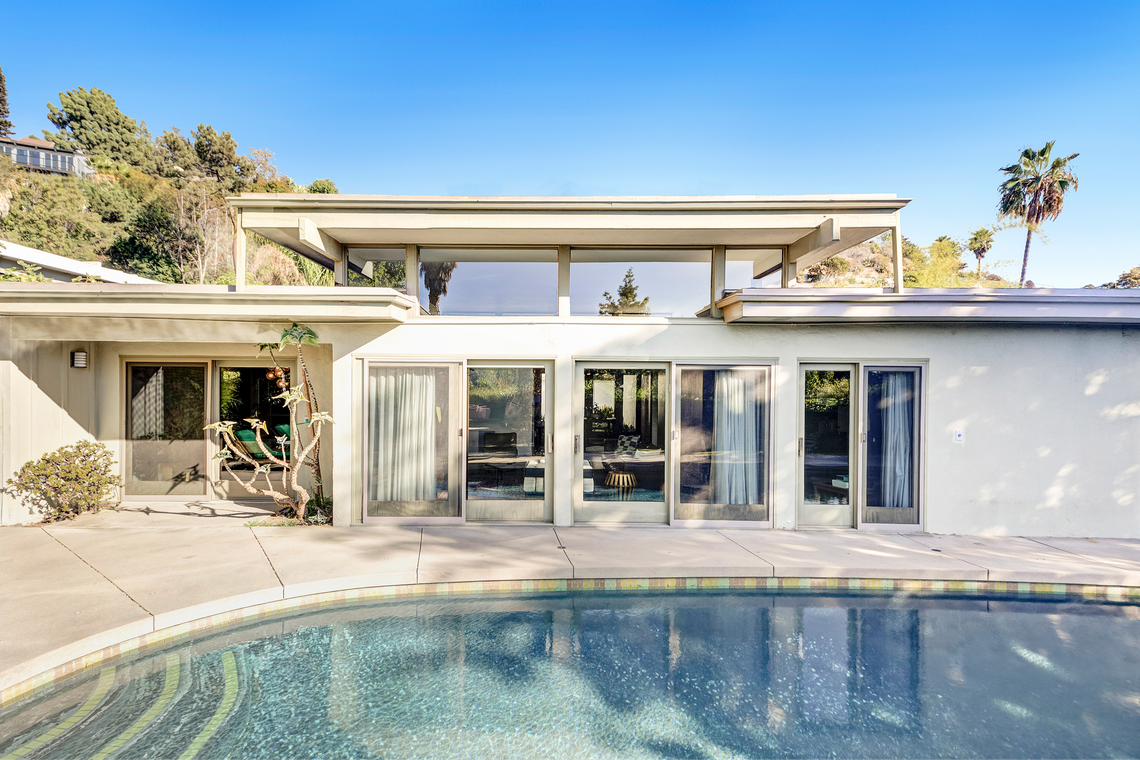 The 1961 mid-century post-and-beam residence is a masterpiece of modernist design.