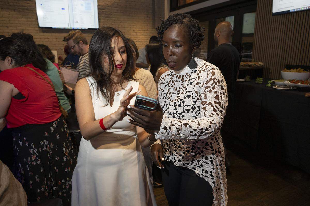 Sacramento Supervisor candidate Flojaune Cofer looks at early results with Council member Karina Talamantes during her election night party at The Lock & Key in midtown Sacramento on Tuesday, June 2, 2026.