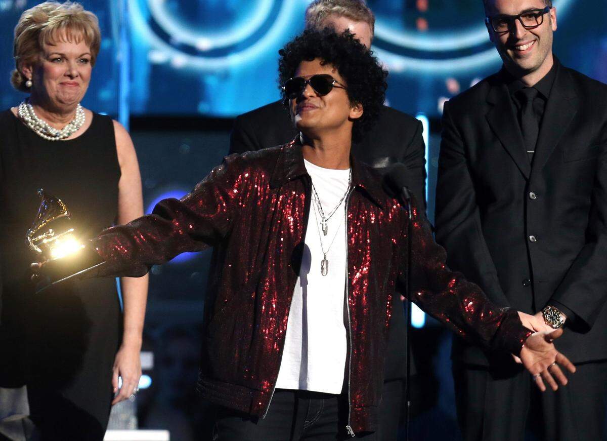 Bruno Mars accepts the award for record of the year for “24K Magic” at the 60th annual Grammy Awards on Jan. 28, 2018, in New York.