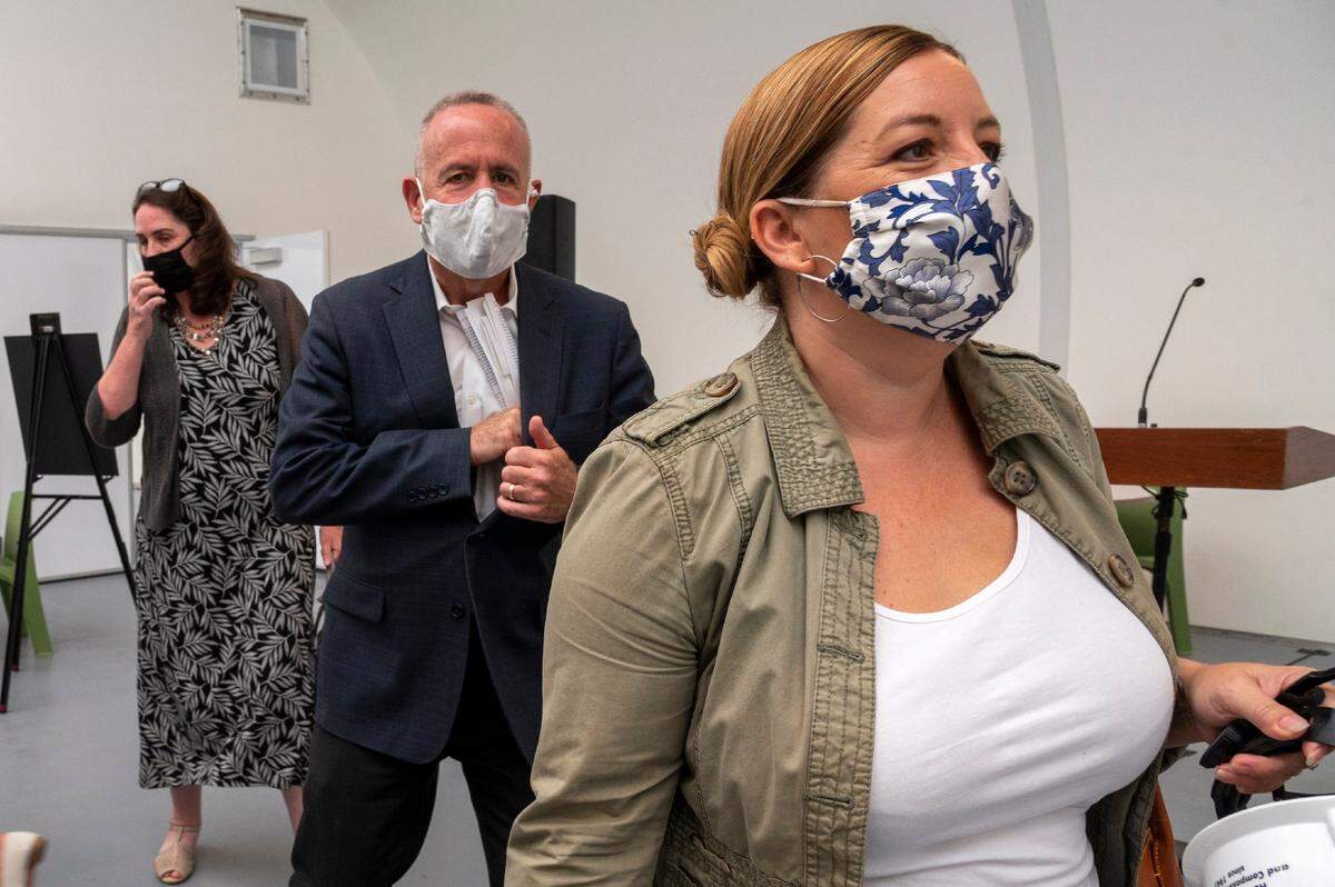 Sacramento City Councilwoman Angelique Ashby, right, and Mayor Darrell Steinberg, center, tour a Sprung shelter in Meadowview on Monday, Aug.17, 2020, after a press conference releasing a $62 million spending plan to address homelessness and the shortage of affordable housing.