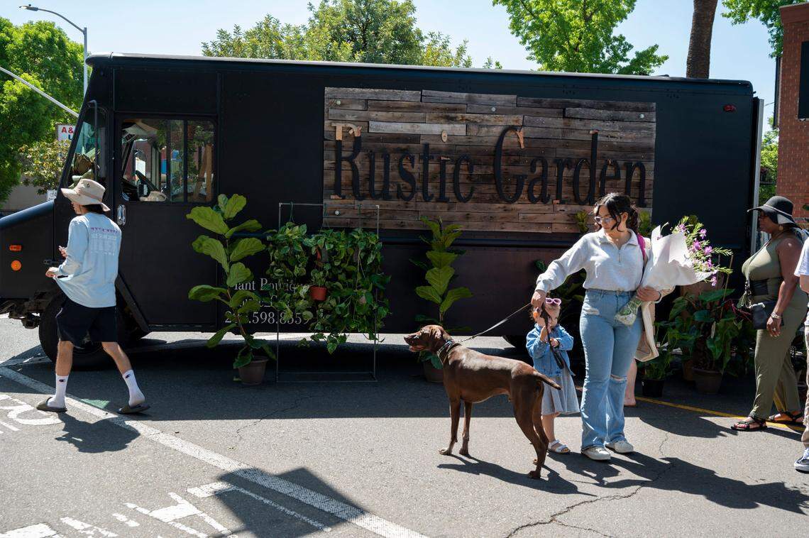 People shop at the Midtown Farmer’s Market on Saturday, April 30, 2022. It’s ​is a pet-friendly year-round market that offers locally-grown fresh produce, prepared foods, artisian crafters and more.