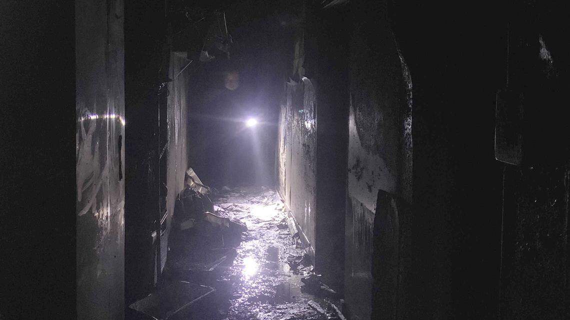 A building worker sifts through the kitchen area of Sam’s Hof Brau on Tuesday, Feb. 7, 2023, in Arden Arcade. The restaurant, a long time staple in the area, was heavily damaged in a two-alarm fire earlier in the morning.