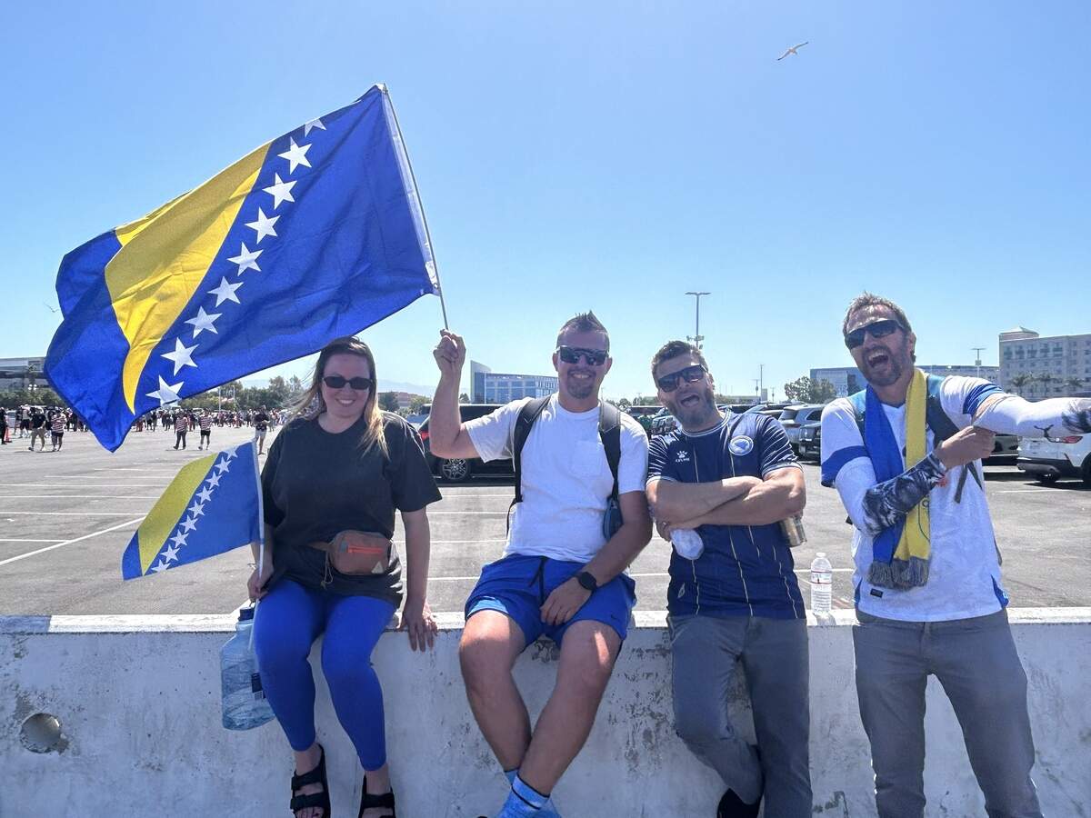From left: Danielle Michalek, Damir Halilovic, Damir Popovac and Enes Vela Velic pose for a photo outside Levi’s Stadium for the World Cup Round of 32 game Wednesday between the U.S. and Bosnia and Herzegovina in Santa Clara.