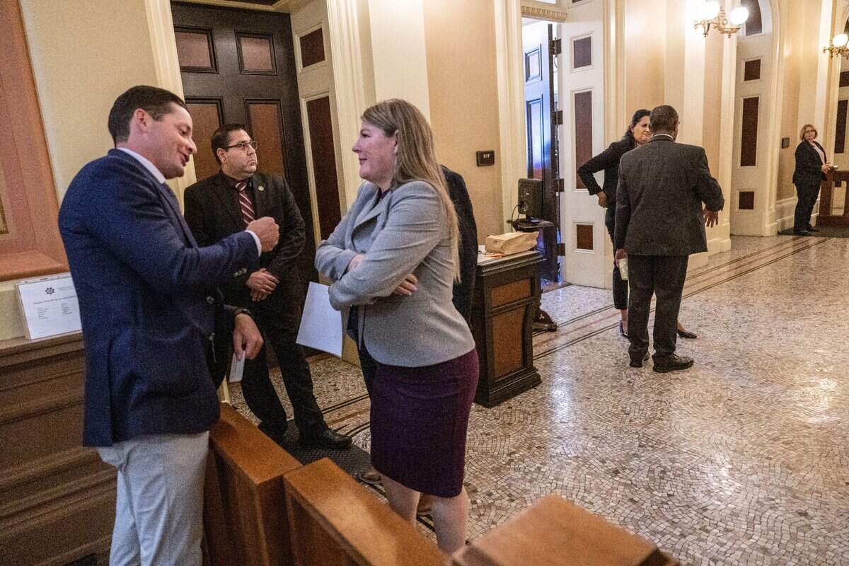 Assemblywoman Tasha Boerner, D-Encinitas, talks with a lobbyist at the state Capitol on Tuesday during the final week of the legislative session.