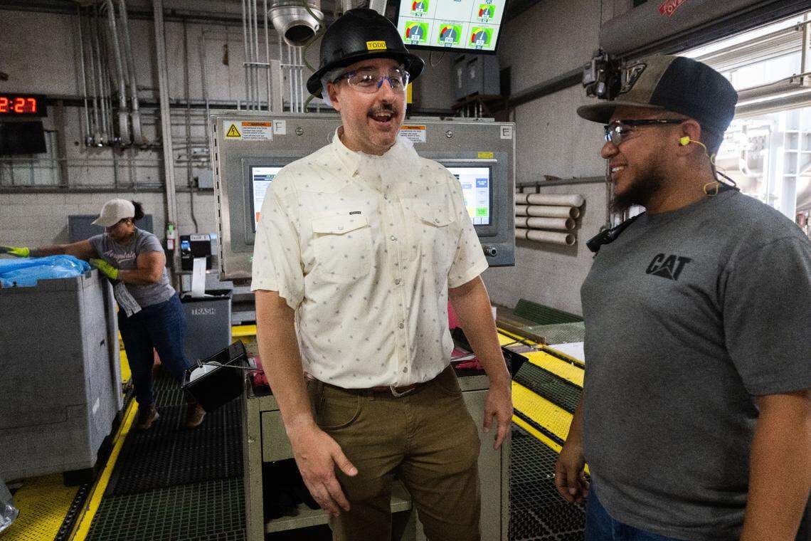 Todd Rufer, one of the family owners of Morning Star, talks to an employee at the processing plant earlier this month. This plant exemplifies how the tomato is one of California’s great innovations.