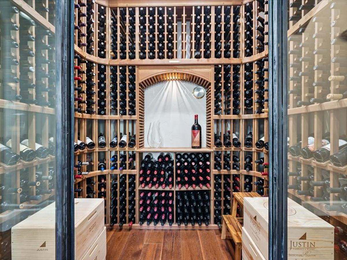 The custom wine room has controlled temperature and humidity.